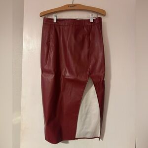 This is a Commense Back Slit Faux Leather Midi Pencil Skirt in burgundy.